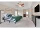 Spacious main bedroom featuring carpeted floors and a view to the main bathroom at 179 Bradshaw Park Dr, Woodstock, GA 30188