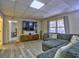 Basement living area features a modern entertainment setup and comfortable seating at 3012 Asheton Ne Pl, Marietta, GA 30068