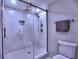 Modern bathroom featuring a glass-enclosed shower with stylish tilework and sleek fixtures at 3012 Asheton Ne Pl, Marietta, GA 30068
