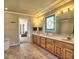 Elegant bathroom featuring double vanities, stylish fixtures, and a separate soaking tub at 3012 Asheton Ne Pl, Marietta, GA 30068