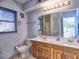 Bathroom boasts double vanity, wood cabinets, and neutral color palette at 3012 Asheton Ne Pl, Marietta, GA 30068