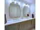 Elegant bathroom with double sinks, gold fixtures, and stylish mirrors providing a luxurious feel at 3012 Asheton Ne Pl, Marietta, GA 30068