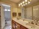 Bathroom featuring a double vanity and a separate toilet and shower area at 3012 Asheton Ne Pl, Marietta, GA 30068