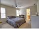 Bedroom featuring a comfortable bed and access to the attached bathroom at 3012 Asheton Ne Pl, Marietta, GA 30068