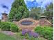 Beautiful stone entrance to Ashebrooke with manicured landscaping, creating a sense of arrival at 3012 Asheton Ne Pl, Marietta, GA 30068