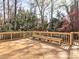 Expansive wooden deck features built-in bench seating, perfect for outdoor entertaining and relaxing at 3012 Asheton Ne Pl, Marietta, GA 30068