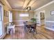 Traditional dining room features hardwood floors, modern light fixture and white trim at 3012 Asheton Ne Pl, Marietta, GA 30068