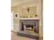 A cozy fireplace with a brick surround adds warmth and character to the living space at 3012 Asheton Ne Pl, Marietta, GA 30068