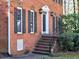 A charming front entrance with brick steps, black shutters, and a well-maintained exterior at 3012 Asheton Ne Pl, Marietta, GA 30068