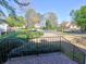 A lovely view from the front porch overlooks a well-kept lawn and a peaceful neighborhood street at 3012 Asheton Ne Pl, Marietta, GA 30068