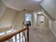 Upstairs hallway with carpet and multiple bedrooms at 3012 Asheton Ne Pl, Marietta, GA 30068