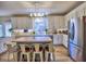 Bright kitchen featuring stainless steel appliances, island, and a large sink window at 3012 Asheton Ne Pl, Marietta, GA 30068