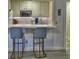 Kitchen bar area with stylish seating, modern appliances, and ample counter space for casual dining at 3012 Asheton Ne Pl, Marietta, GA 30068