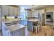 Bright eat-in kitchen with white cabinets, stainless steel appliances, and a center island at 3012 Asheton Ne Pl, Marietta, GA 30068