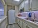 Efficient kitchen boasts white cabinets, stainless steel appliances, and under-cabinet lighting at 3012 Asheton Ne Pl, Marietta, GA 30068
