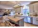 Open-concept kitchen with stainless steel appliances, a large island, and hardwood floors at 3012 Asheton Ne Pl, Marietta, GA 30068