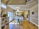 Open-concept living area with wood floors, dining area, and view of the modern kitchen at 3012 Asheton Ne Pl, Marietta, GA 30068