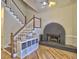 Living room featuring a cozy fireplace and hardwood floors at 3012 Asheton Ne Pl, Marietta, GA 30068