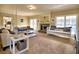 Inviting living room with a fireplace, daybed, plush sofas, and plenty of natural light at 3012 Asheton Ne Pl, Marietta, GA 30068