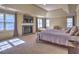 Spacious main bedroom with fireplace, tray ceiling, and large windows offering natural light at 3012 Asheton Ne Pl, Marietta, GA 30068