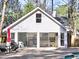 Pool house has kitchen, seating, and dogs enjoying the summer sun at 3012 Asheton Ne Pl, Marietta, GA 30068