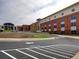 The school building's exterior showcases a modern design with ample parking and green spaces at 3012 Asheton Ne Pl, Marietta, GA 30068