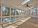Sunroom with skylights, ceiling fan, and a view of the pool and backyard at 3012 Asheton Ne Pl, Marietta, GA 30068