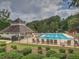 Large community pool with ample lounge seating and shaded areas, perfect for relaxation and recreation at 3012 Asheton Ne Pl, Marietta, GA 30068
