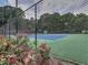 Well-maintained tennis courts with lush landscaping, providing an inviting athletic space at 3012 Asheton Ne Pl, Marietta, GA 30068