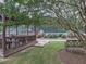 Inviting covered seating area near the tennis courts for relaxing and watching games at 3012 Asheton Ne Pl, Marietta, GA 30068