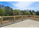 Backyard deck overlooking lush trees and clear skies creates a serene atmosphere at 3774 Thackary Dr, Powder Springs, GA 30127