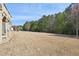 A spacious backyard, surrounded by verdant trees, offers a private and tranquil setting at 3774 Thackary Dr, Powder Springs, GA 30127
