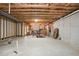 Unfinished basement with exposed beams, creating an opportunity for a customizable space at 3774 Thackary Dr, Powder Springs, GA 30127