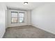 Bright bedroom with neutral walls, plush carpet, and large windows for natural light at 3774 Thackary Dr, Powder Springs, GA 30127