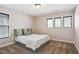 Cozy bedroom with neutral walls, plush carpet, and large windows for natural light at 3774 Thackary Dr, Powder Springs, GA 30127