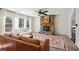 Spacious living room with a stone fireplace, large windows, and two comfortable sofas at 3774 Thackary Dr, Powder Springs, GA 30127