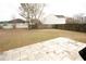 Expansive backyard featuring a stone patio and fenced perimeter, providing ample space for outdoor activities at 102 Silver Fox Trl, Dallas, GA 30157