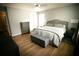 Comfortable bedroom featuring modern decor, wood-look floors, and ample space at 102 Silver Fox Trl, Dallas, GA 30157