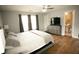 Bright bedroom with a view of the bathroom, and wood look floors at 102 Silver Fox Trl, Dallas, GA 30157