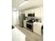Bright kitchen with stainless steel appliances and light wood flooring at 102 Silver Fox Trl, Dallas, GA 30157