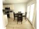 Bright kitchen with stainless steel appliances and adjacent dining area at 102 Silver Fox Trl, Dallas, GA 30157