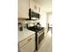 Stainless steel stove and cooktop in kitchen with white shaker cabinets at 102 Silver Fox Trl, Dallas, GA 30157