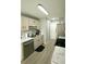 Bright kitchen featuring stainless steel appliances, light countertops, and wood-look flooring at 102 Silver Fox Trl, Dallas, GA 30157
