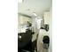 Eat-in kitchen featuring stainless steel appliances, light-colored cabinets, and laminate flooring at 102 Silver Fox Trl, Dallas, GA 30157