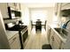 Modern kitchen with stainless steel appliances and adjacent dining area at 102 Silver Fox Trl, Dallas, GA 30157