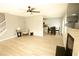 Open-concept living room and kitchen area with light gray walls and light-colored laminate flooring at 102 Silver Fox Trl, Dallas, GA 30157
