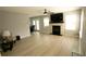 Spacious living room featuring a fireplace and light-colored laminate flooring and light gray walls at 102 Silver Fox Trl, Dallas, GA 30157