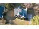 Aerial view of a brick home with a large yard and mature trees at 3152 Parks Run, Loganville, GA 30052