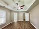 Primary bedroom featuring trey ceiling and wood-look flooring at 3152 Parks Run, Loganville, GA 30052