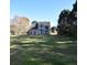 A house in a large yard with mature trees in the background at 3152 Parks Run, Loganville, GA 30052